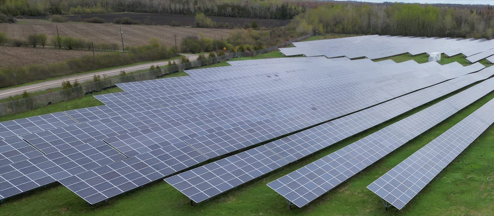 Rows of ground-mounted solar modules on a utility-scale array